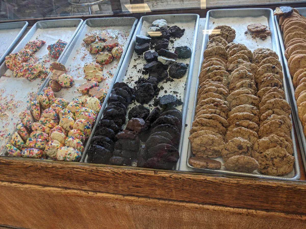 Trays of sprinkle cookies, chocolate cookies and other baked goods at Chester's
